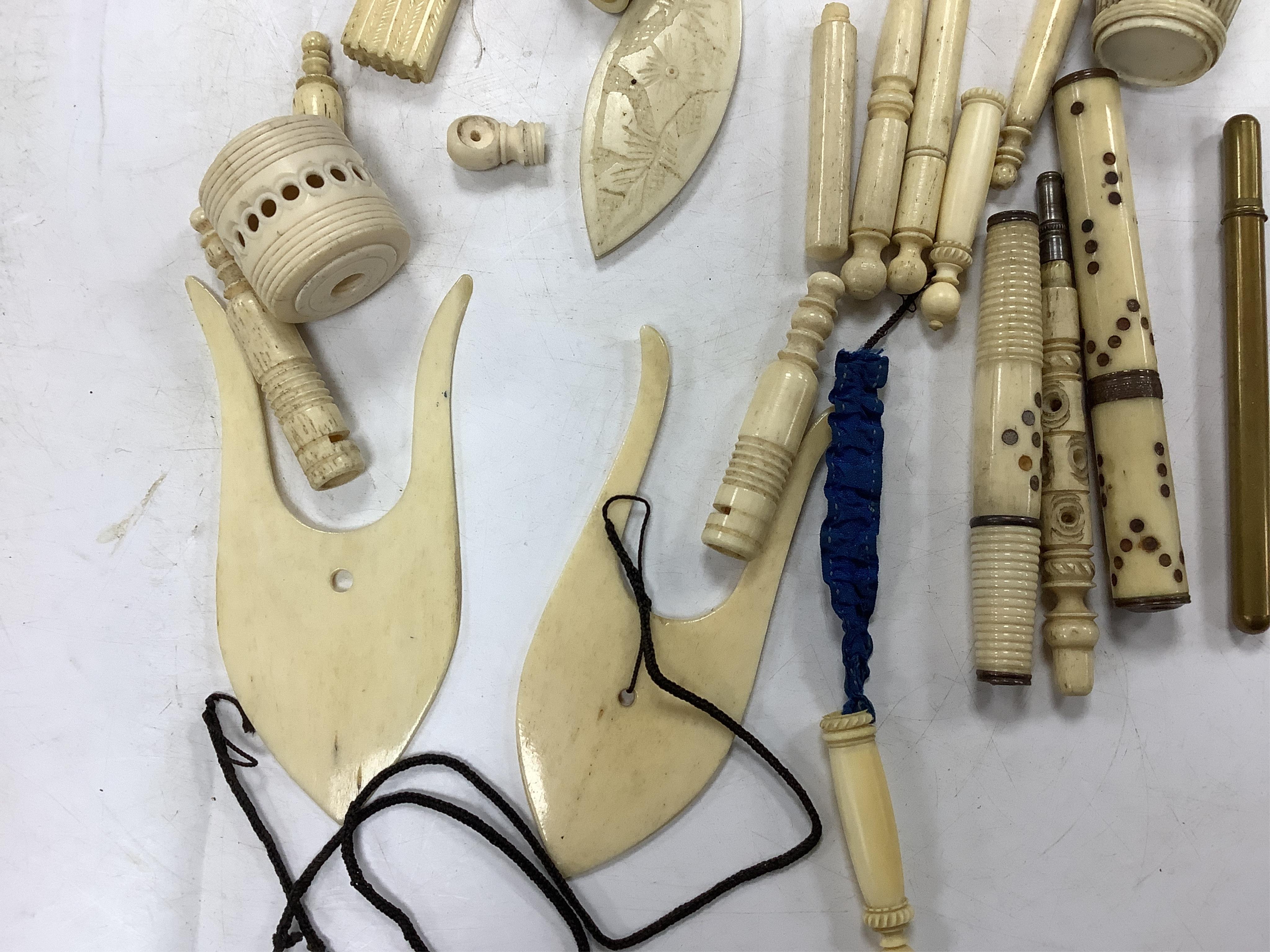 A collection of early 19th century and later bone needlework bodkin cases, two thimbles etc. Condition- some wear and a few items cracked